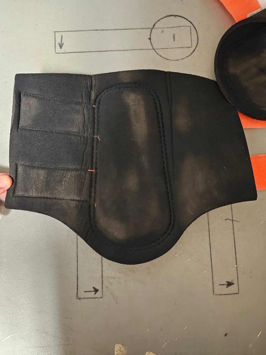 Large orange and black Woof Wear brushing boots Large