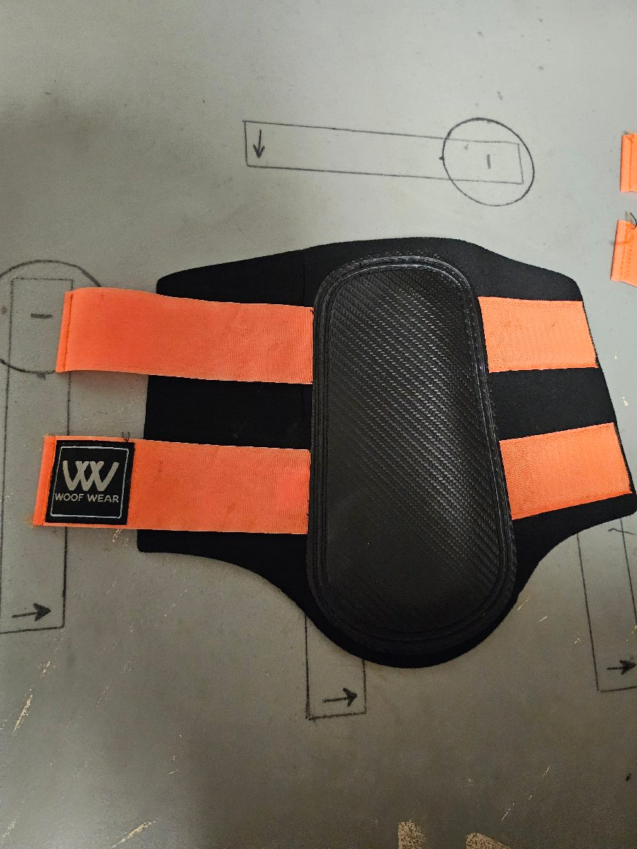 Large orange and black Woof Wear brushing boots Large