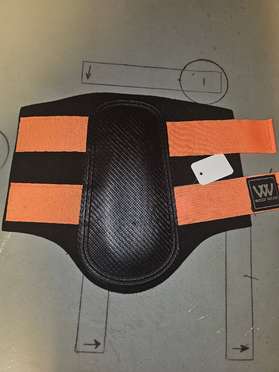 Large orange and black Woof Wear brushing boots Large